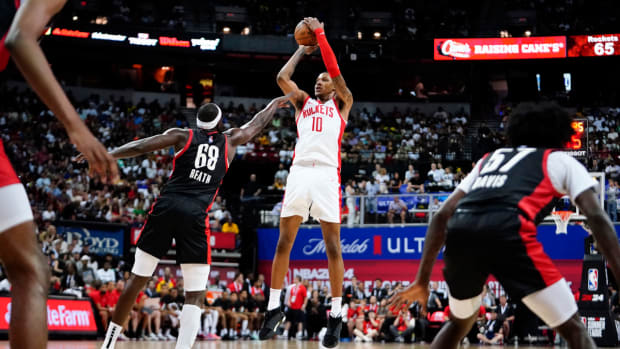 Jul 7, 2023; Las Vegas, NV, USA; Houston Rockets forward Jabari Smith Jr. (10) shoots the ball against Portland Trail Blazers center Duop Reath (68) during the second half at Thomas & Mack Center. Mandatory Credit: Lucas Peltier-USA TODAY Sports